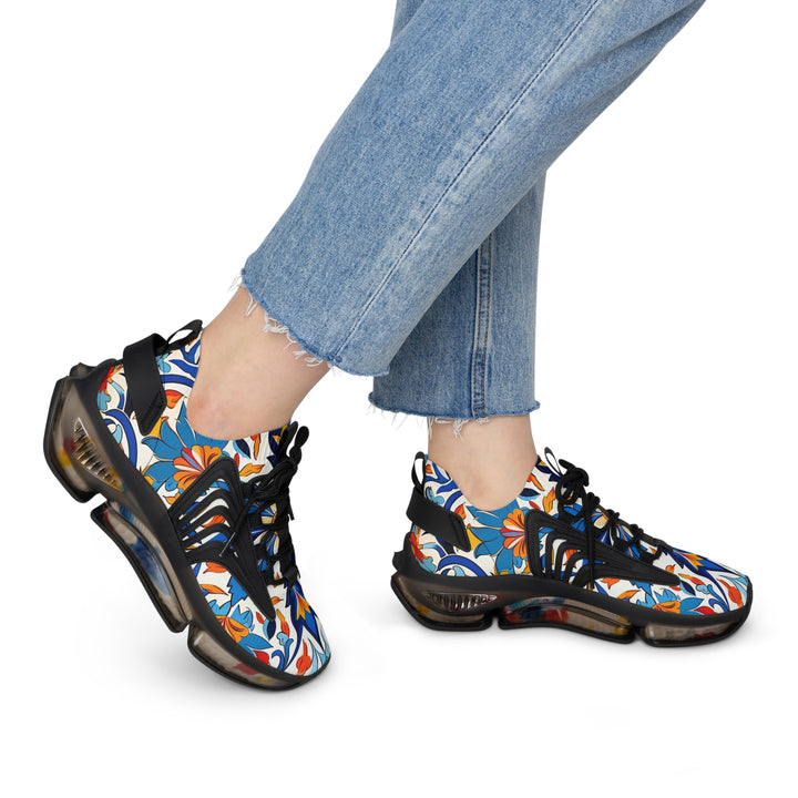 White-Orange-Blue Floral Abstraction Female Mesh Sneakers with black sole on model, side view