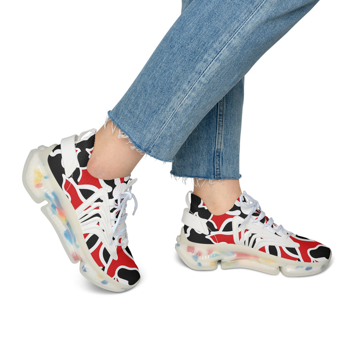 Abstracted Red Black White Women's Mesh Sneakers with white sole on model, side view